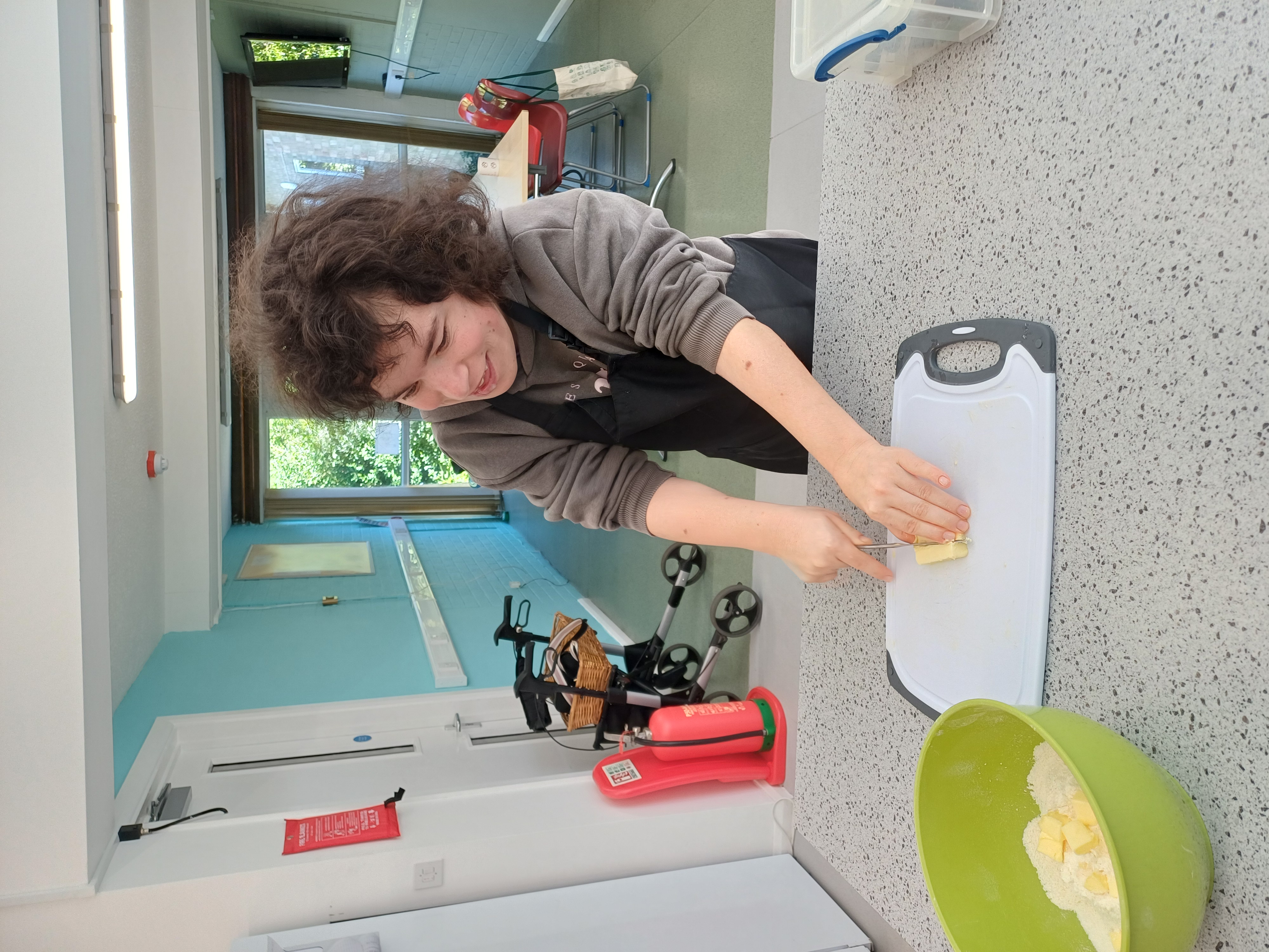 A customer chopping in a kitchen