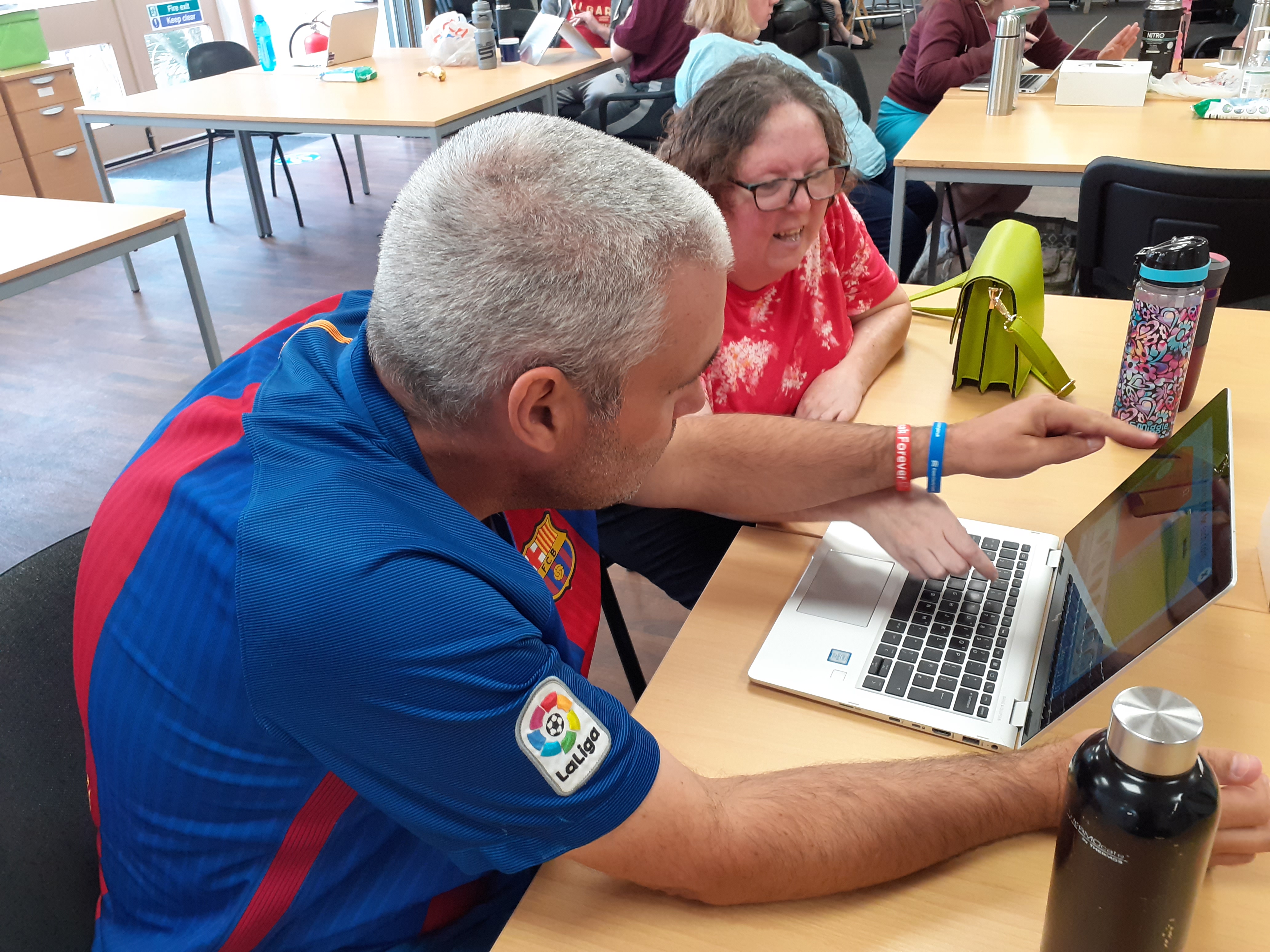 Customers doing maths on the new Deloitte laptops