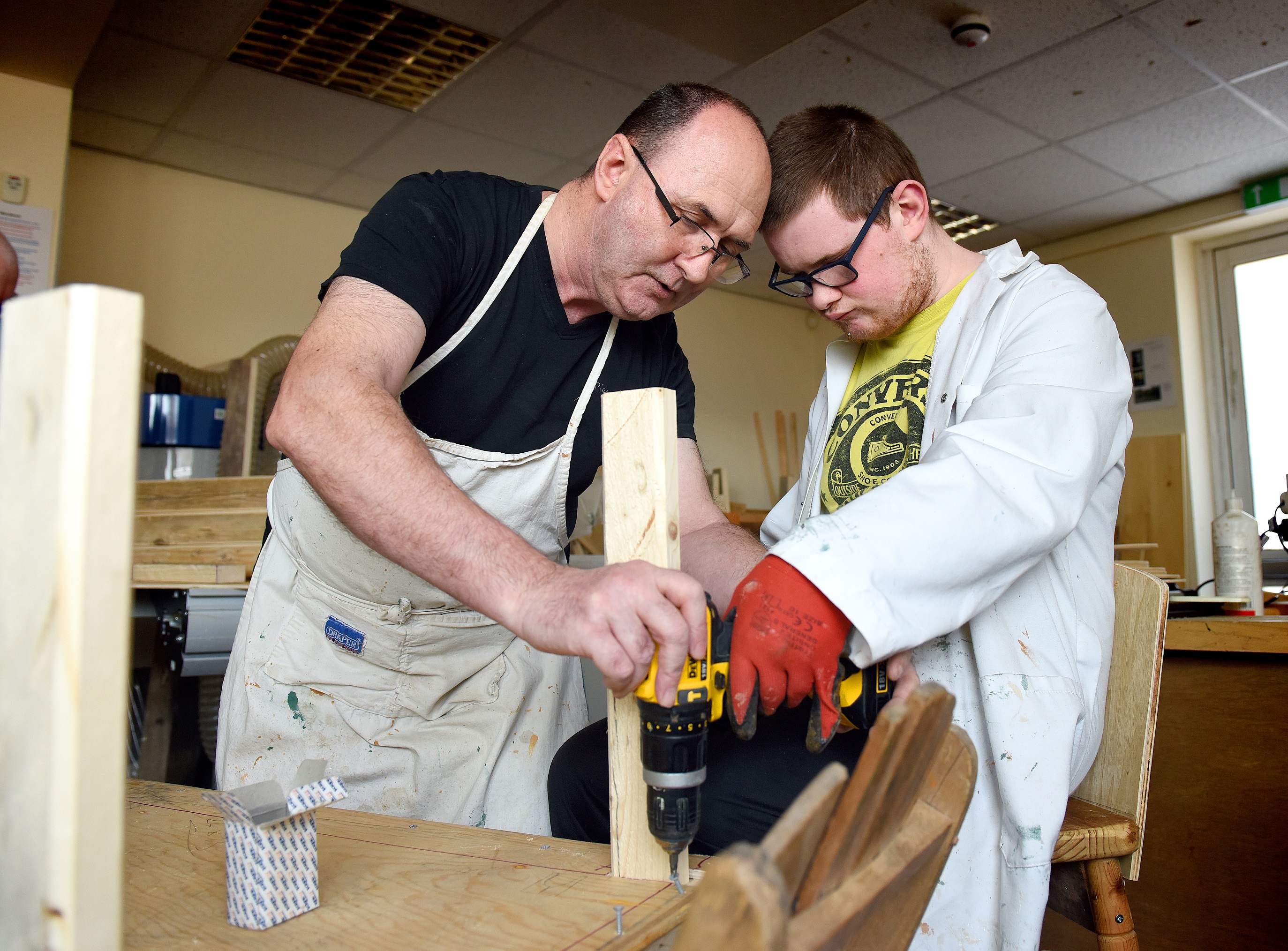 A customer doing woodwork