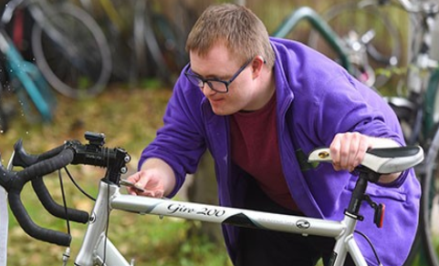 a man carrying out a bike maintenance check