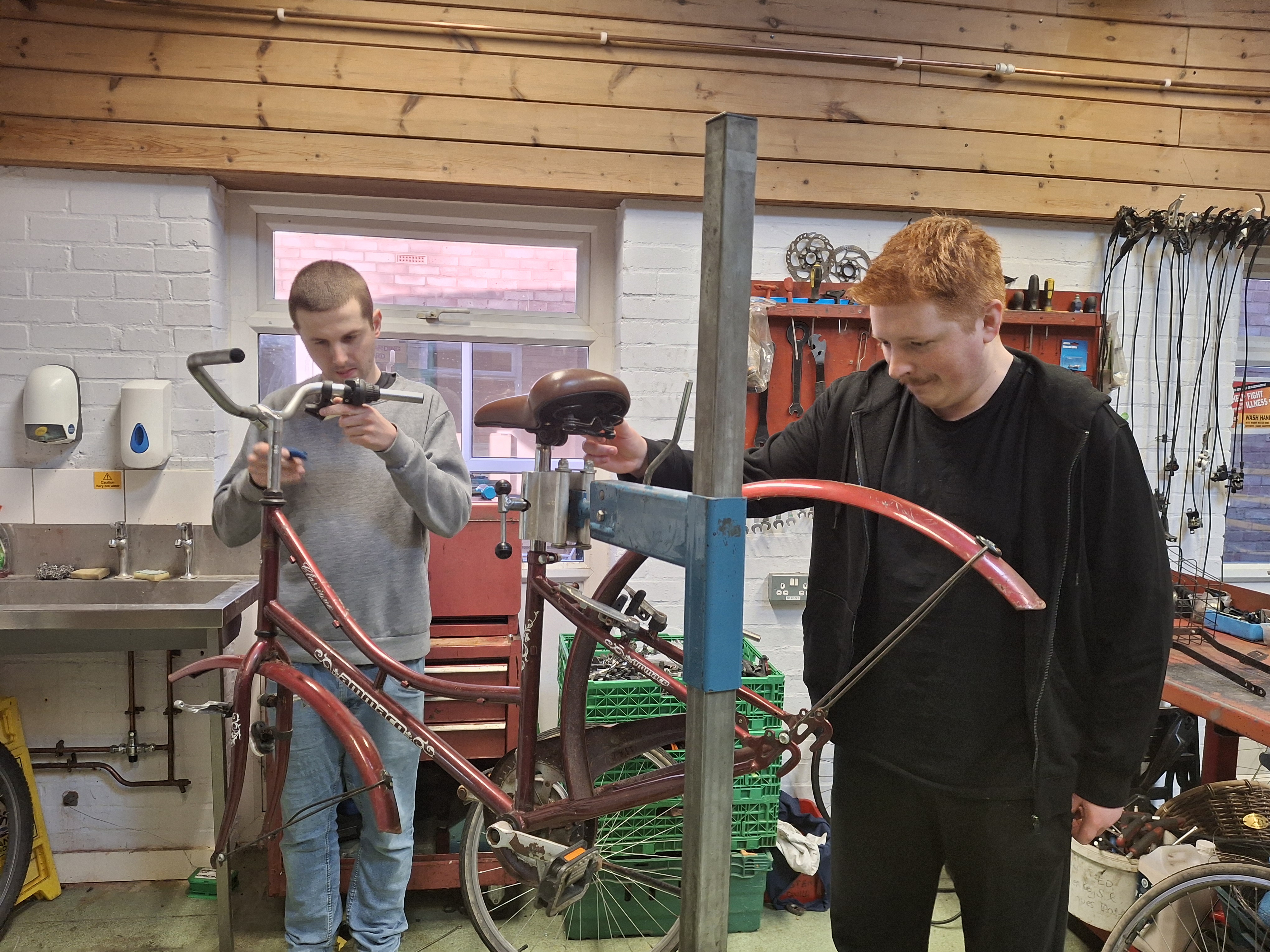Kurt and another customer working on a bike