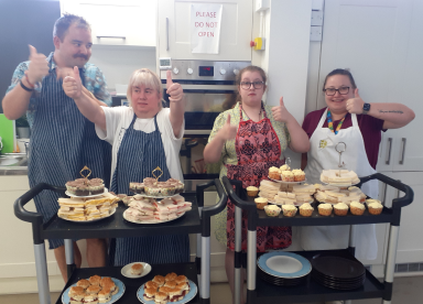 Customers standing with cakes