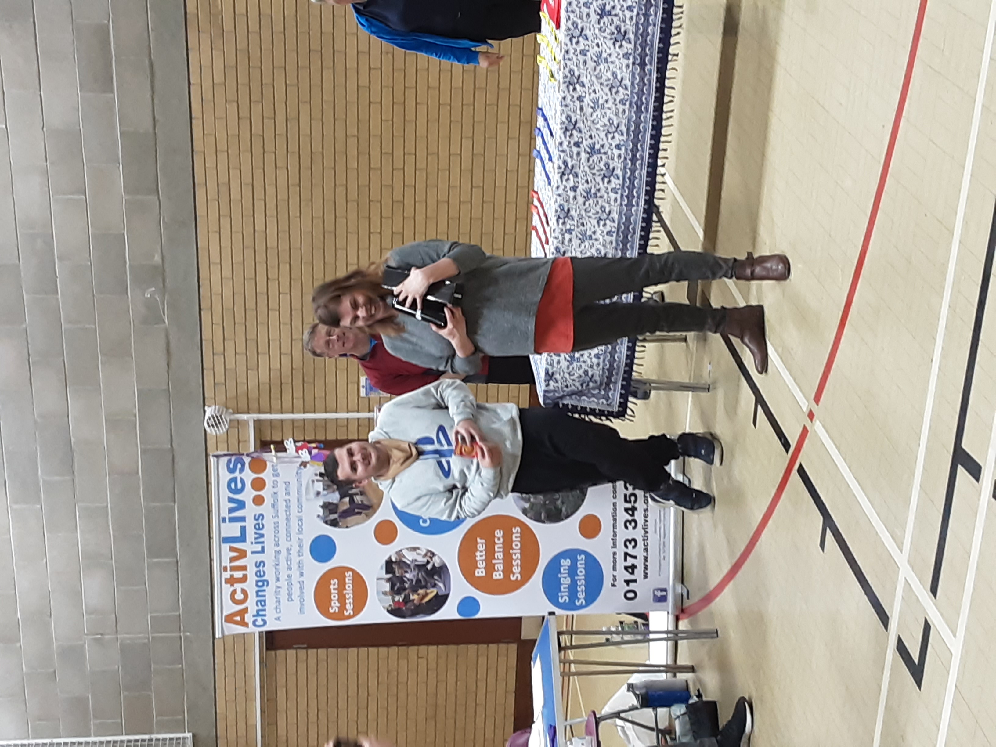 Customer collecting their prize at the Boccia Festival