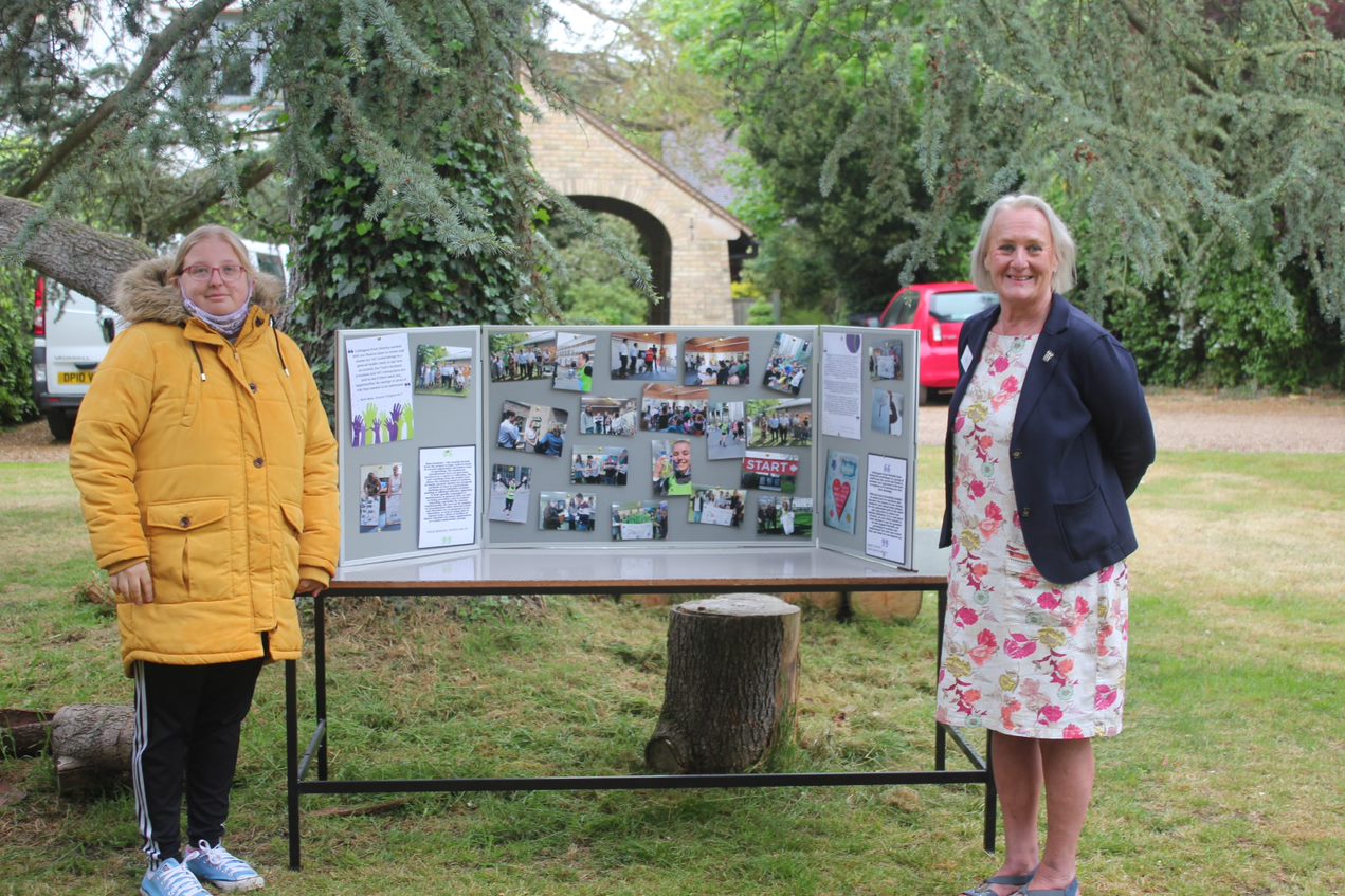 Information Board and Jo Revitt With Customer