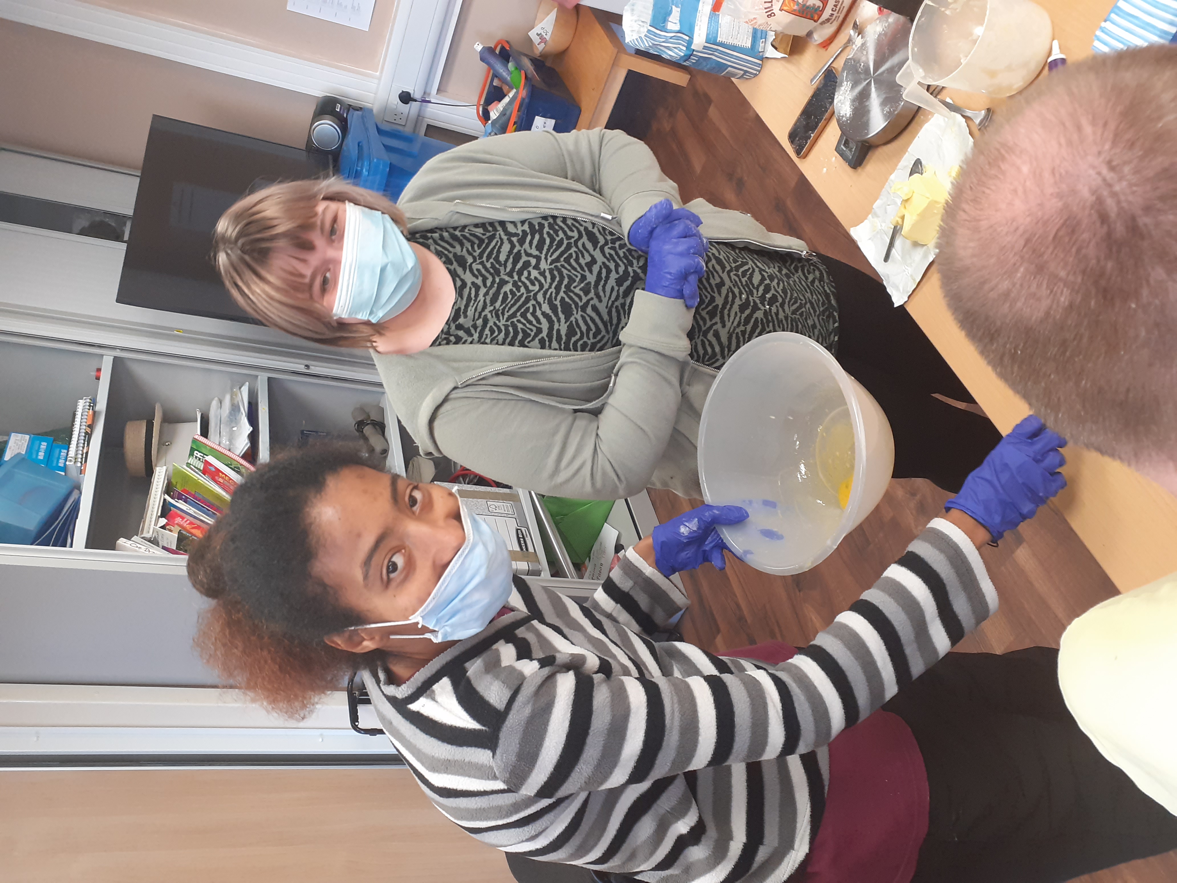 Two Papworth Trust customers baking a cake