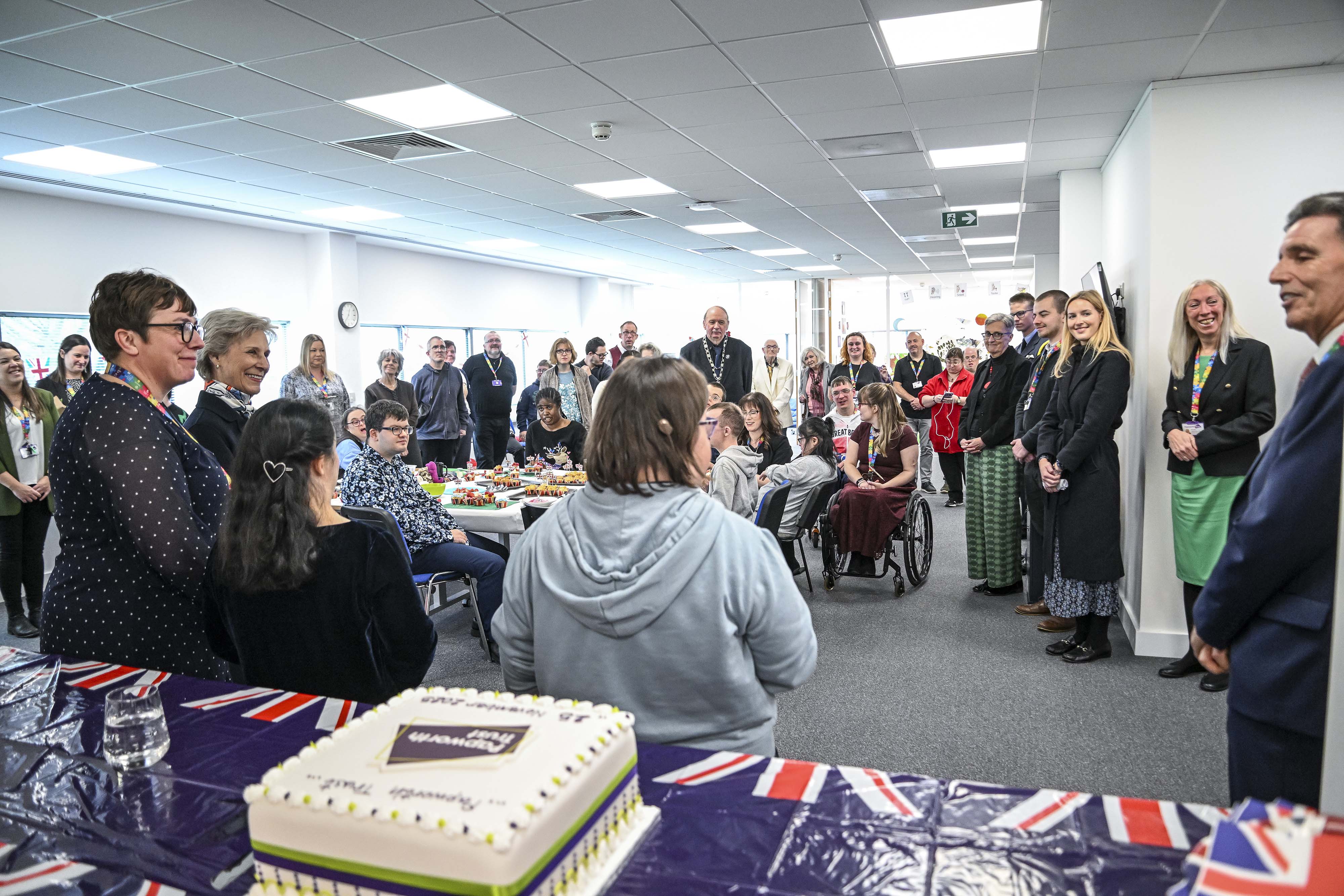 A room full of people listening to speeches