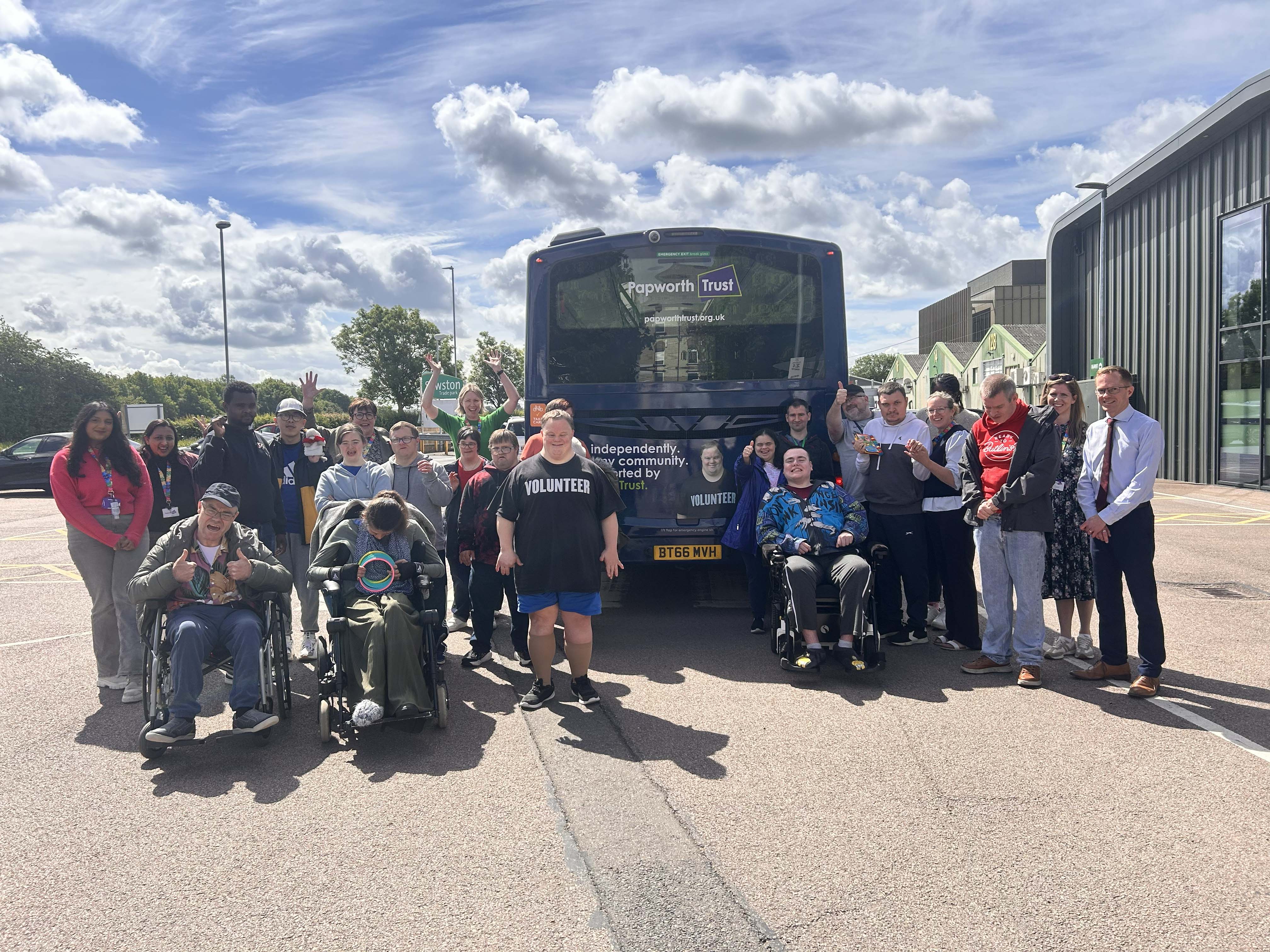 A group of people in front of the bus