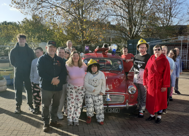 Customers in pajamas with a vintage fire truck