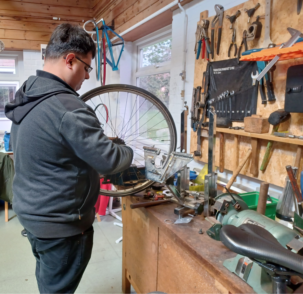 A photo of a volunteer in the workshop